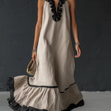 Vestido longo elegante e romântico com babados e blocos de cores.