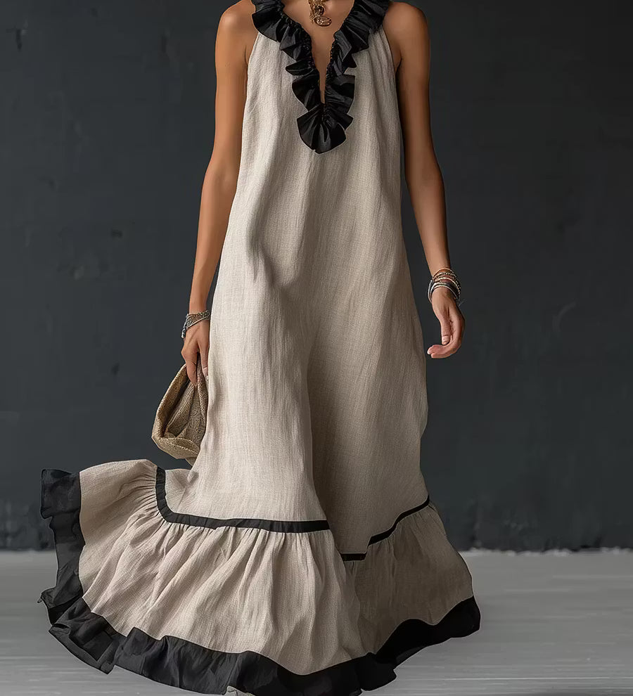 Vestido longo elegante e romântico com babados e blocos de cores.