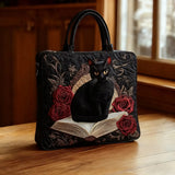 Bolsa artesanal acolchoada - Gato preto sobre livros