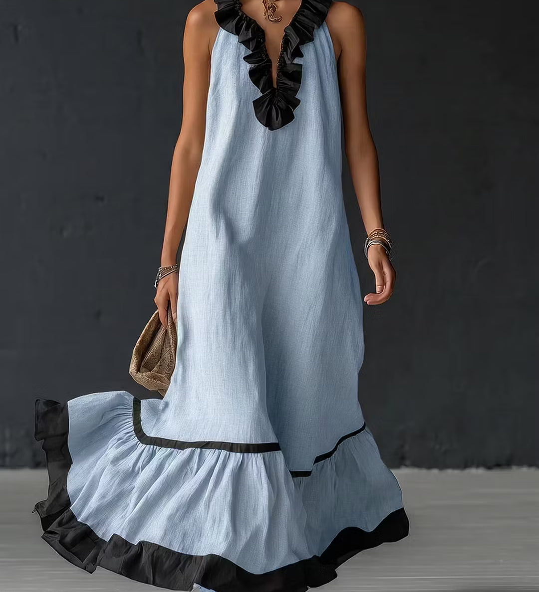 Vestido longo elegante e romântico com babados e blocos de cores.