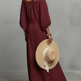Vestido feminino casual de linho com mangas compridas e gola redonda.