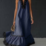 Vestido longo elegante e romântico com babados e blocos de cores.